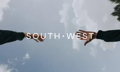 Two hands held up to the sky